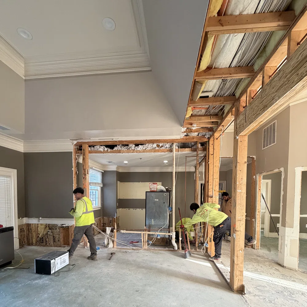 New Construction Builds in Georgia underway as a framing crew installs roof trusses on site